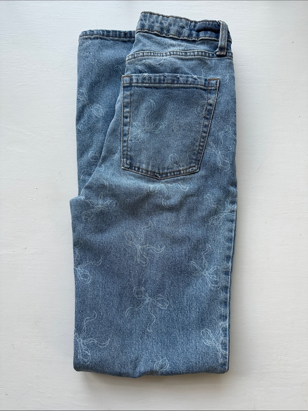 High-Rise, Straight Cut, Med Blue Denim, Bow Print